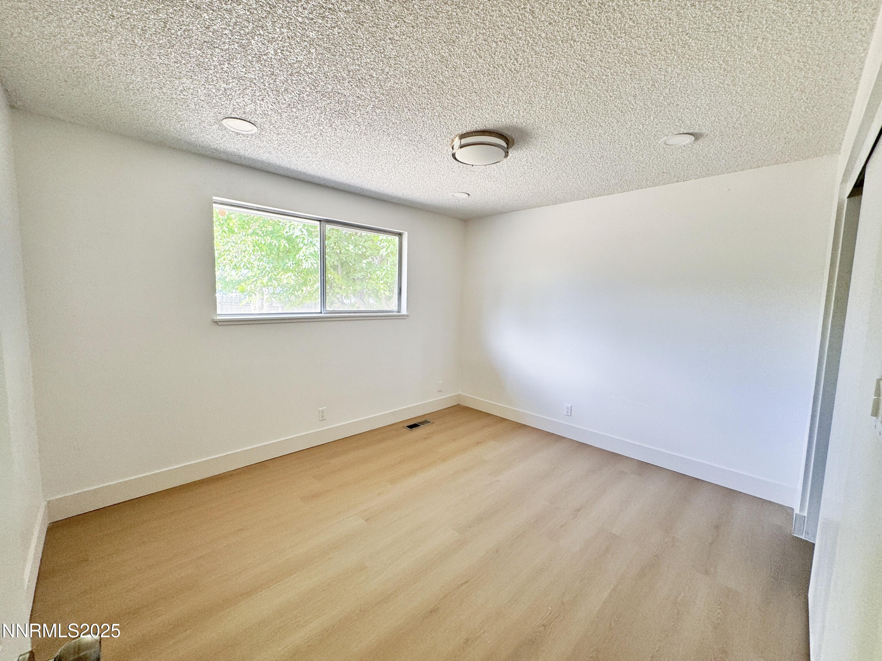 4205 Santa Maria Drive Reno, NV 89502 - Photo 15 of 23 an empty room with a window
