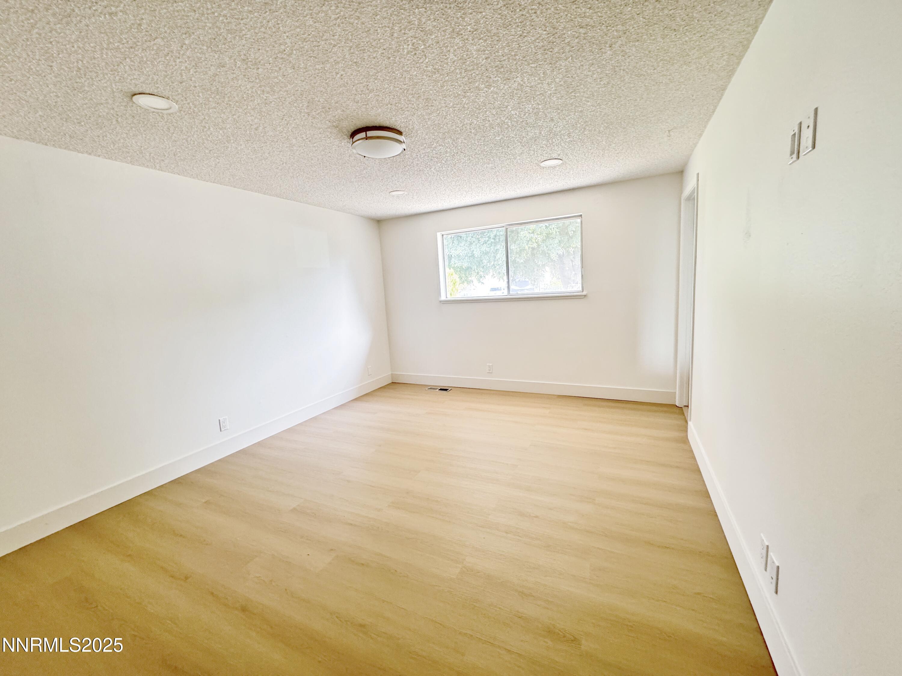 4205 Santa Maria Drive Reno, NV 89502 - Photo 16 of 23 an empty room with a workbench