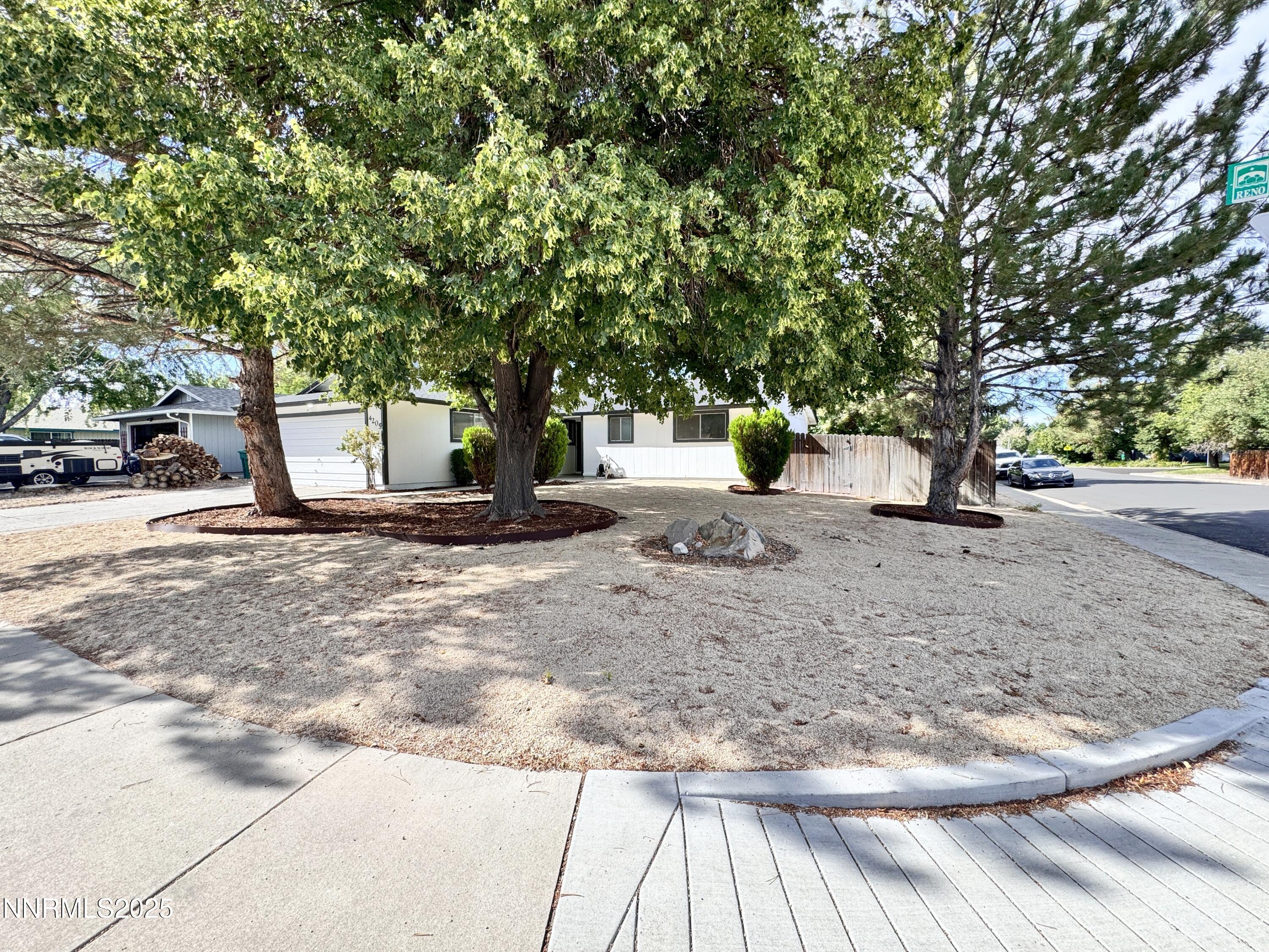4205 Santa Maria Drive Reno, NV 89502 - Photo 4 of 23 a view of dirt yard with a tree