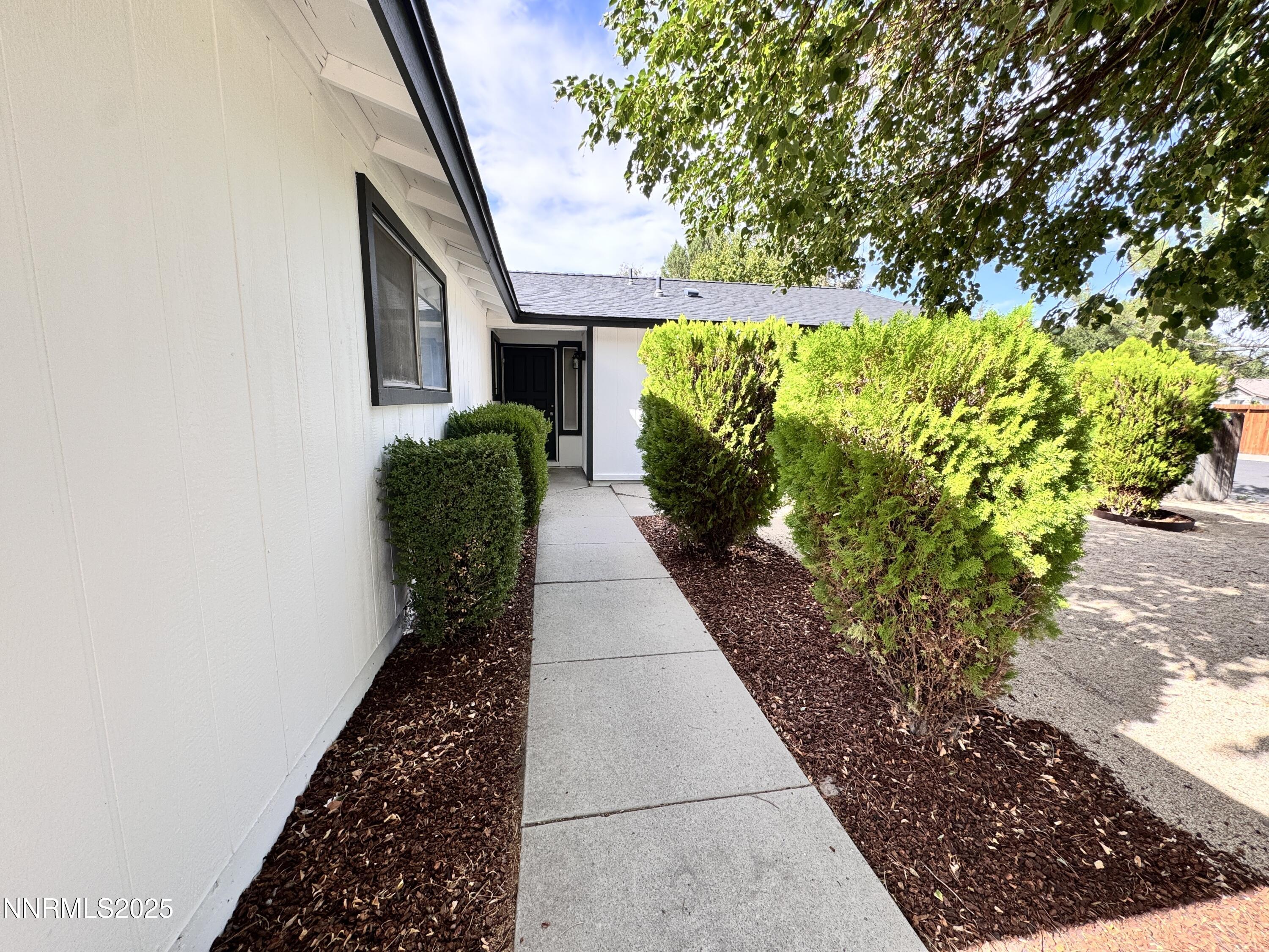 4205 Santa Maria Drive Reno, NV 89502 - Photo 5 of 23 a front view of a house with a yard