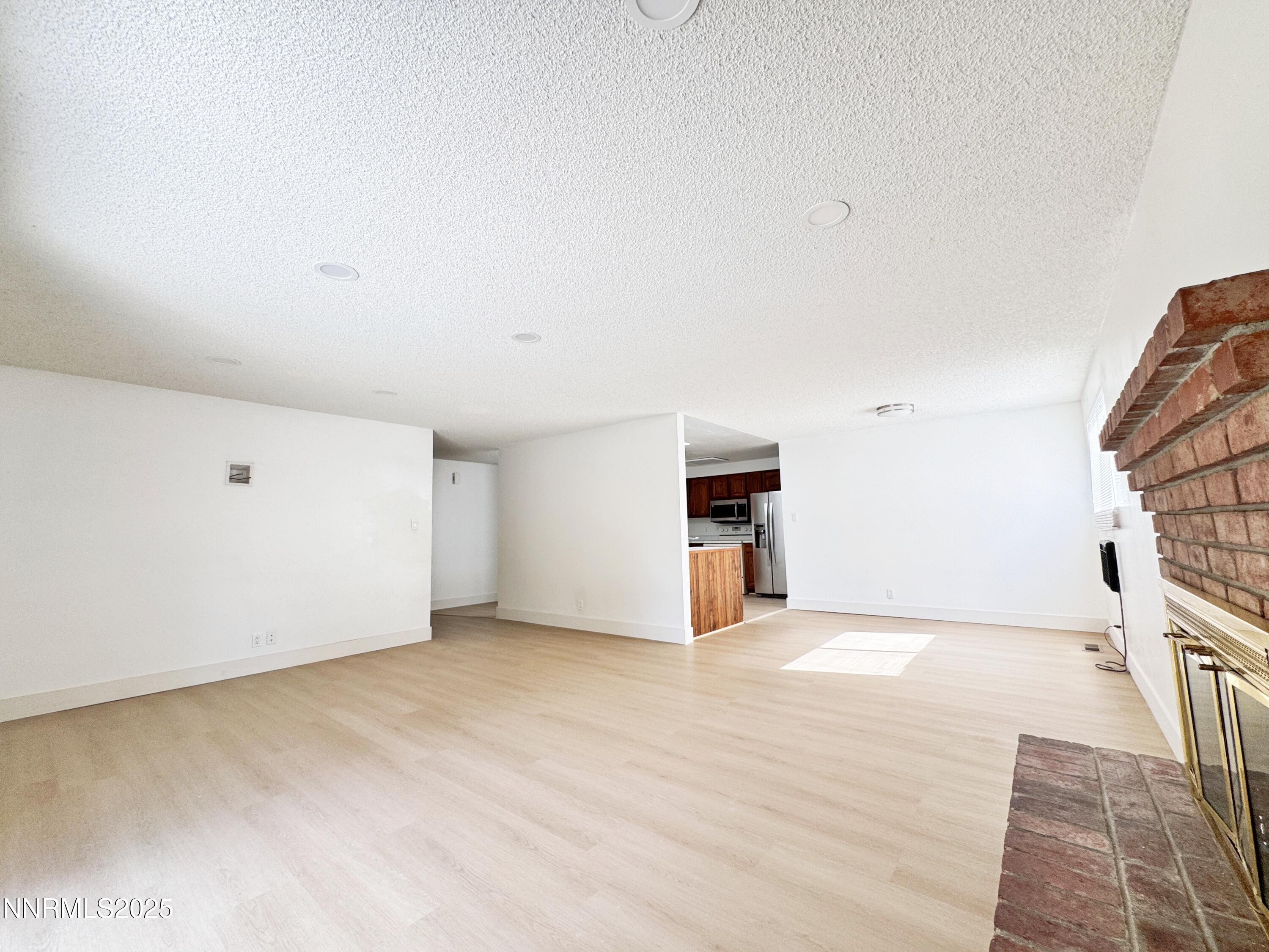 4205 Santa Maria Drive Reno, NV 89502 - Photo 8 of 23 a view of empty room with wooden floor