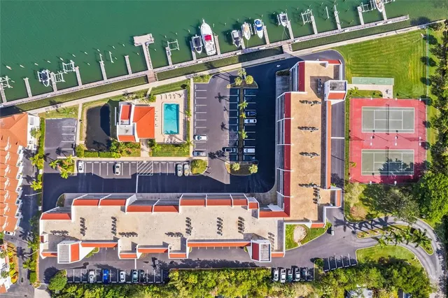 a front view of multi story residential apartment building with yard