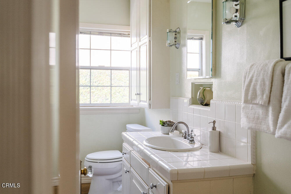 1795 Sonoma Drive Altadena, CA 91001 - Photo 15 of 29 a bathroom with a granite countertop sink and a toilet
