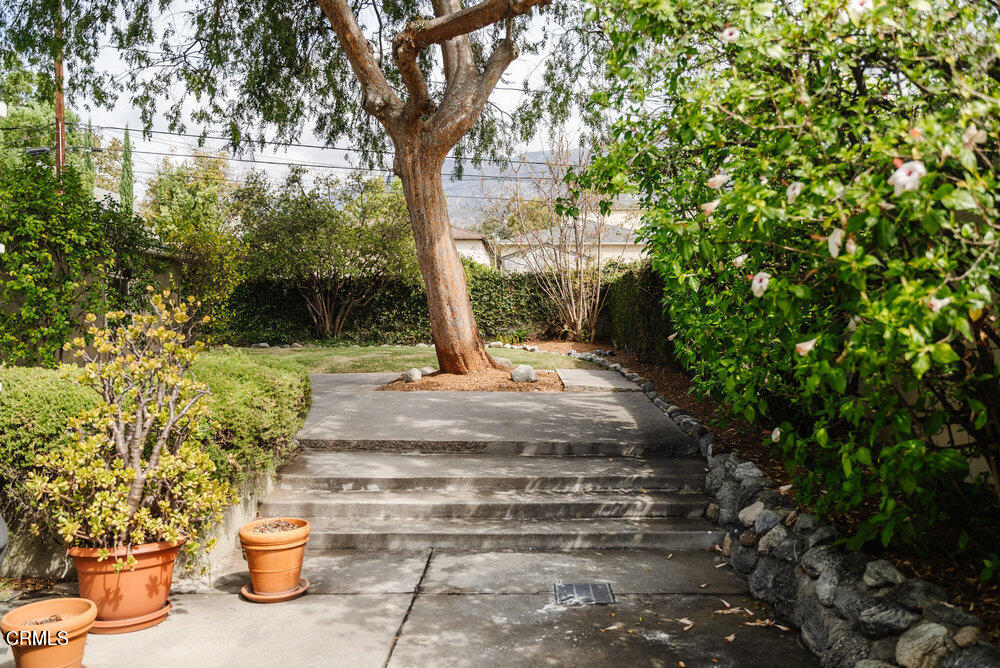 1795 Sonoma Drive Altadena, CA 91001 - Photo 24 of 29 a view of a fountain with plants and a small yard