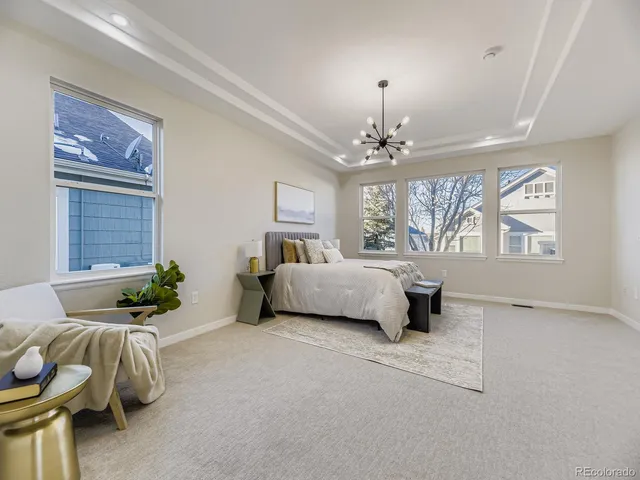 a bedroom with a bed and ceiling fan