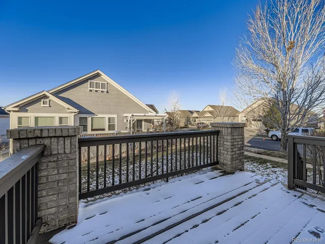 a view of wooden deck and a yard