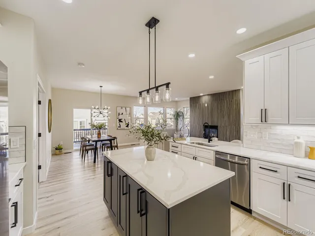 a kitchen with counter top space appliances and cabinets
