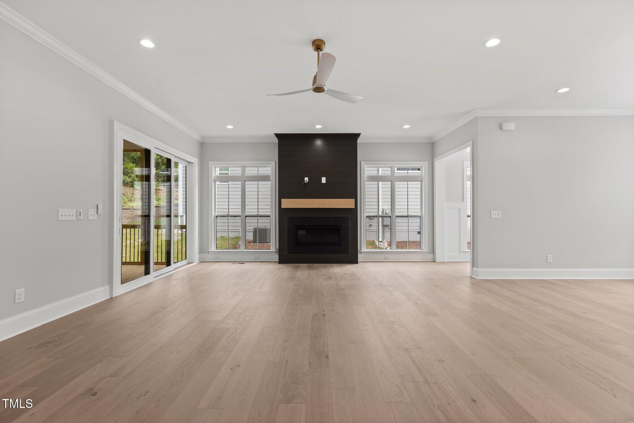 9305 Field Maple Court Raleigh, NC 27613 - Photo 12 of 13 wooden floor in an empty room with a window