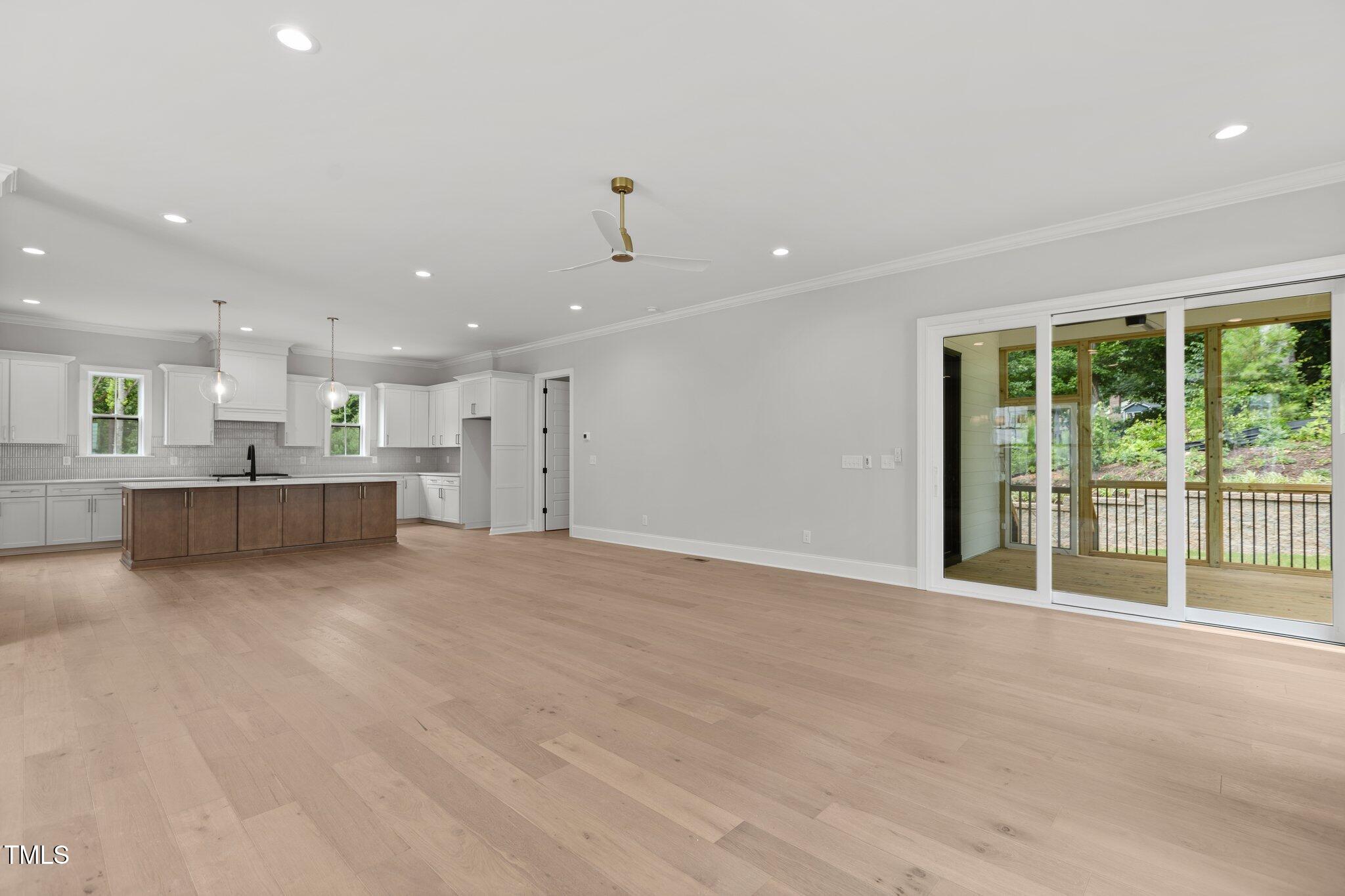 9305 Field Maple Court Raleigh, NC 27613 - Photo 6 of 13 a view of an empty room with a kitchen