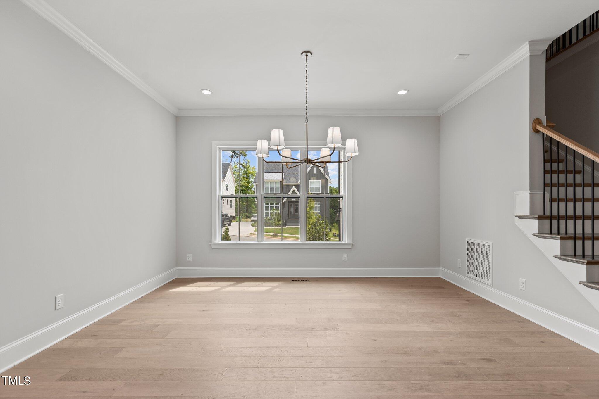9305 Field Maple Court Raleigh, NC 27613 - Photo 9 of 13 a view of a room with windows