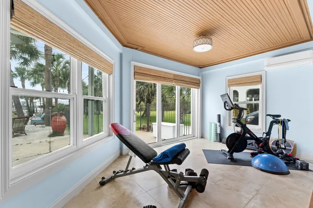 a room with gym equipment and a large window