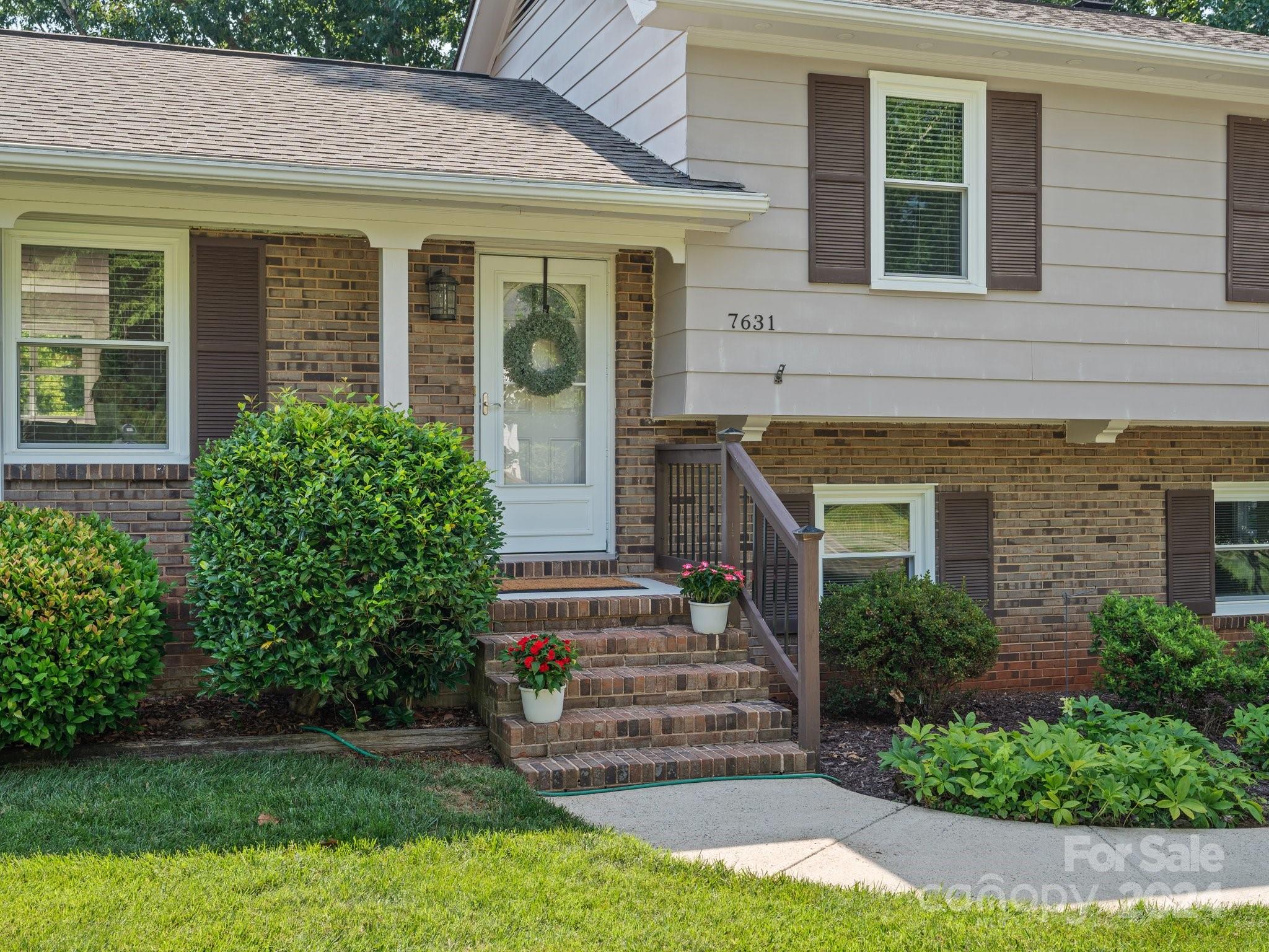 7631 Watercrest Road Charlotte, NC 28210 - Photo 2 of 42 front view of a house with a yard