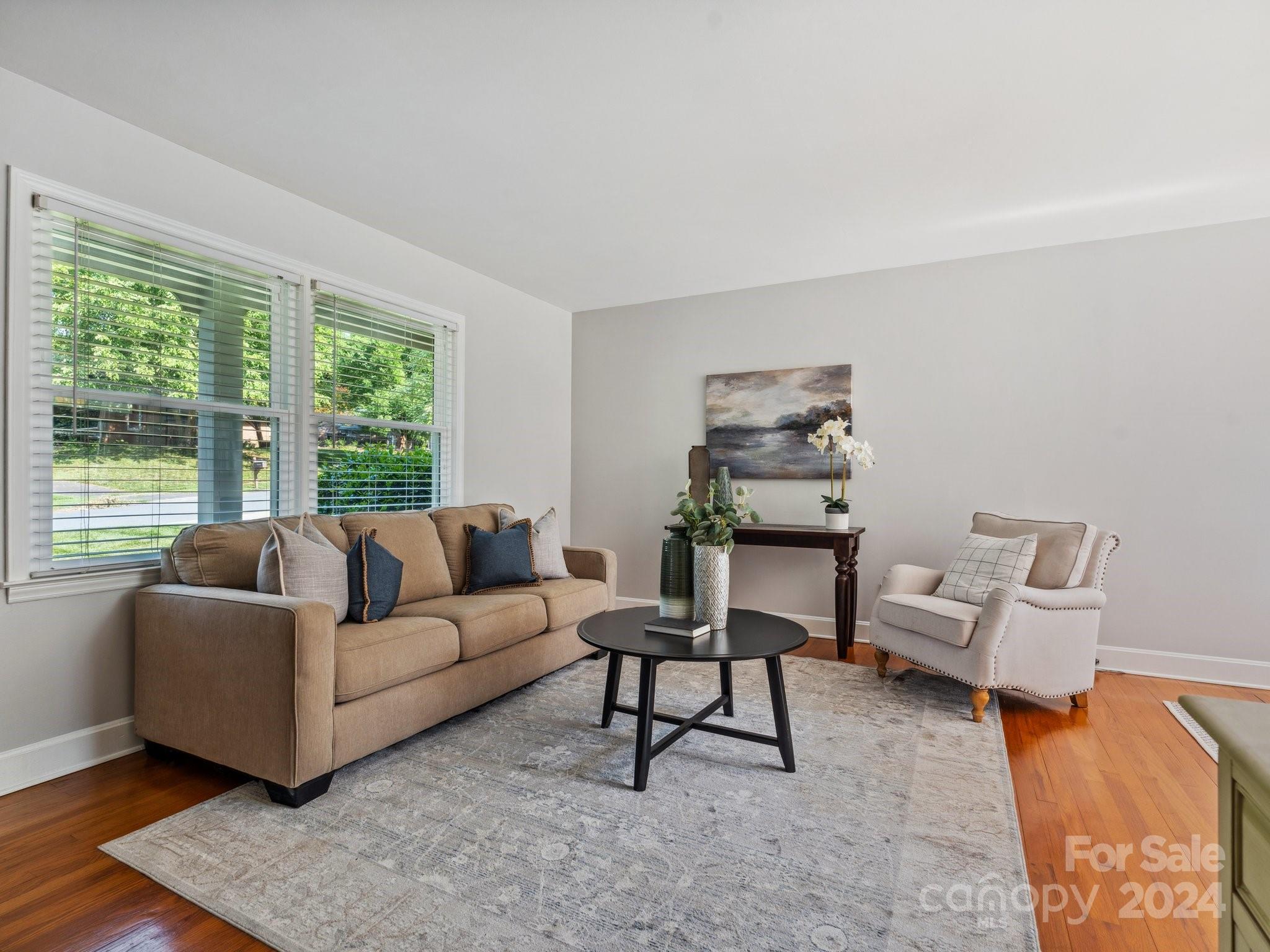 7631 Watercrest Road Charlotte, NC 28210 - Photo 3 of 42 a living room with furniture and a large window