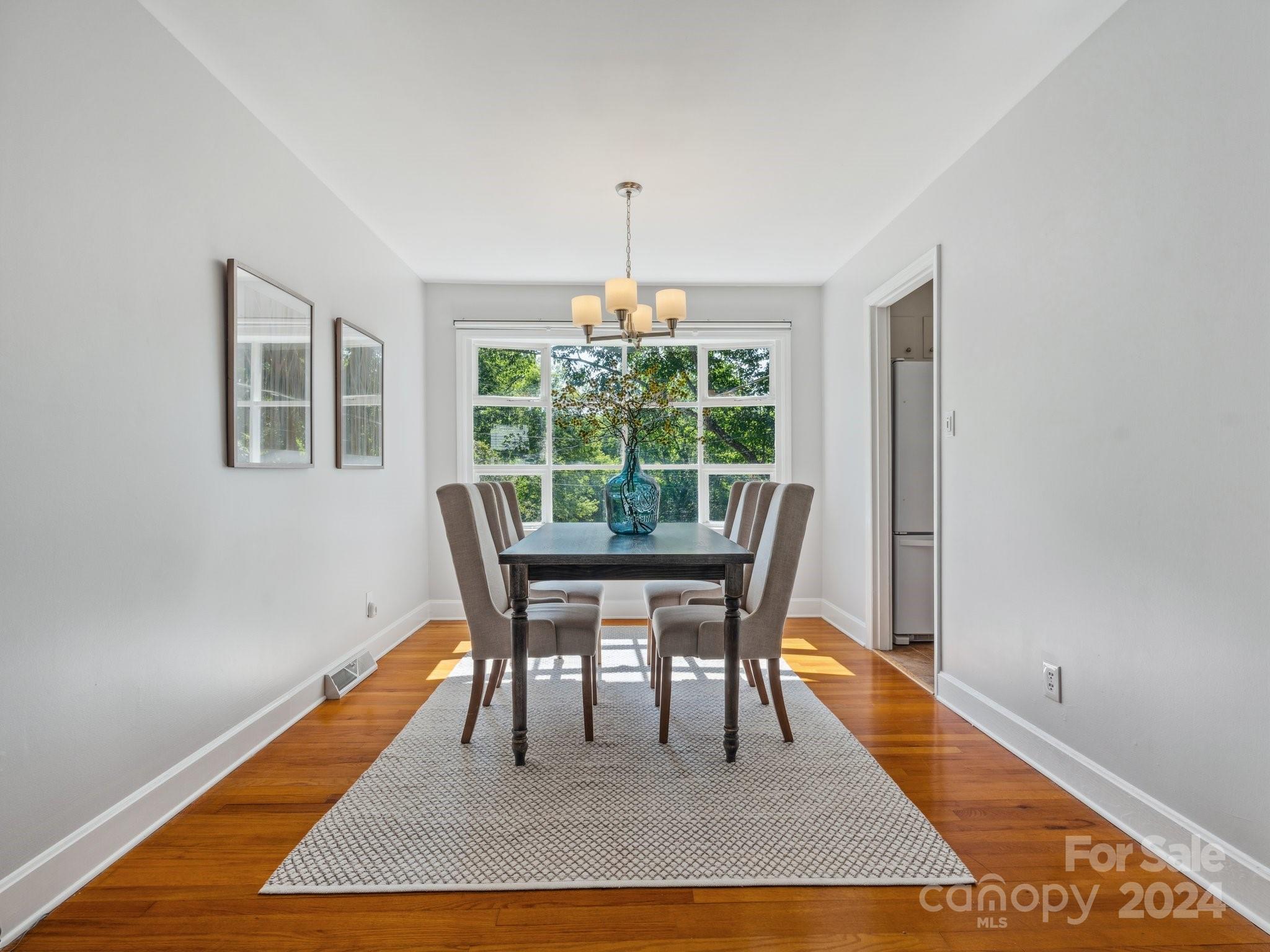 7631 Watercrest Road Charlotte, NC 28210 - Photo 6 of 42 a dining room with furniture and window