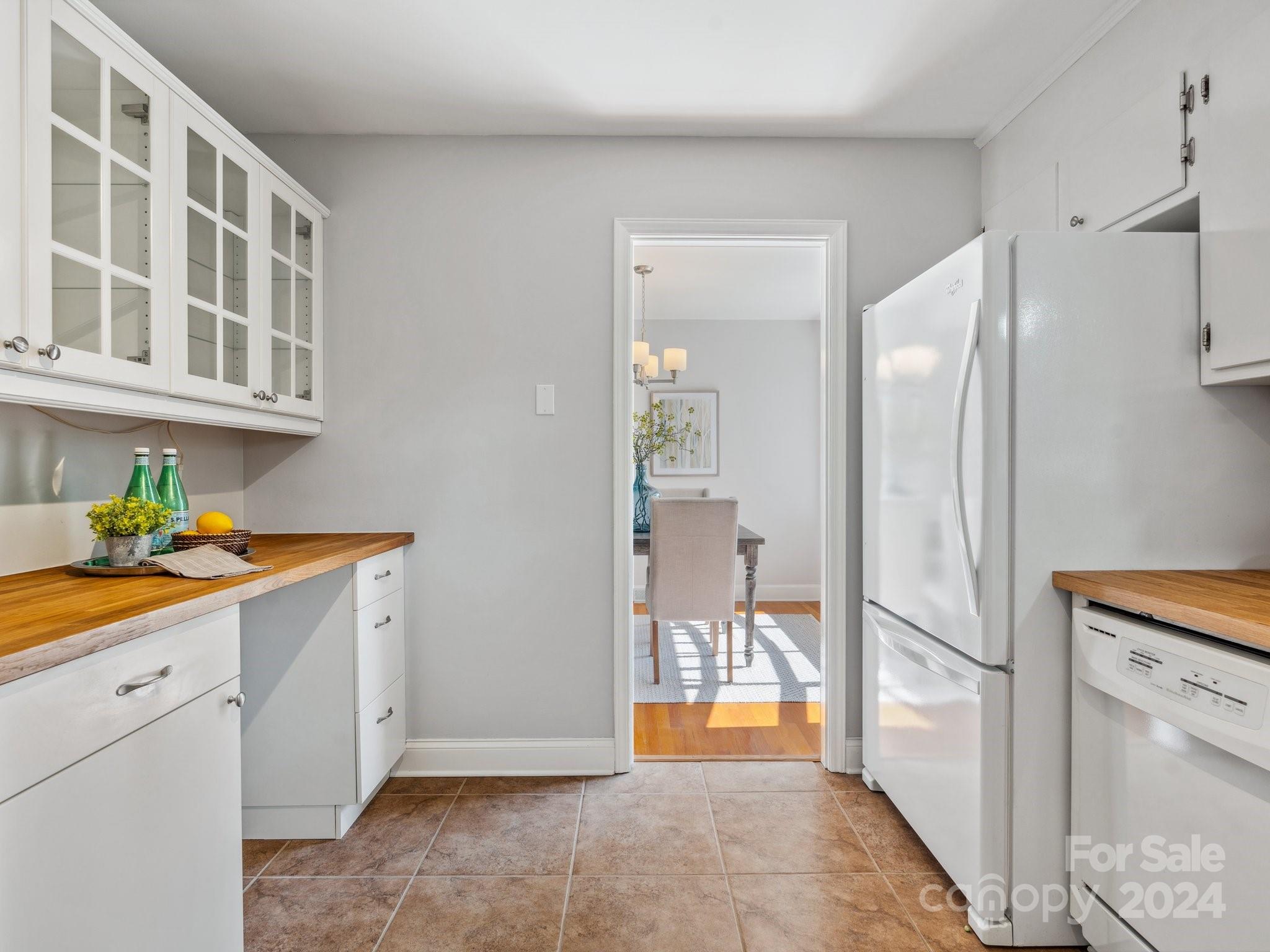 7631 Watercrest Road Charlotte, NC 28210 - Photo 10 of 42 a view of a kitchen with a sink and dishwasher