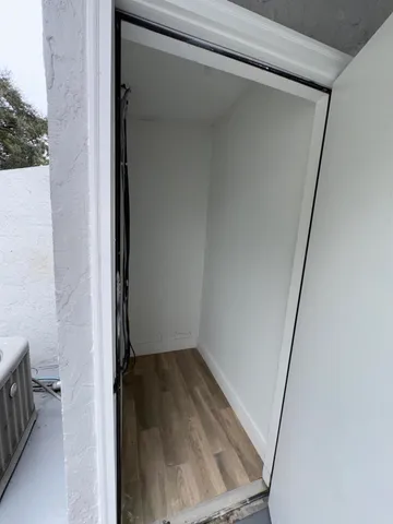 a view of an empty room with a window