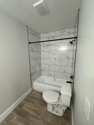 a view of an empty room with a sink