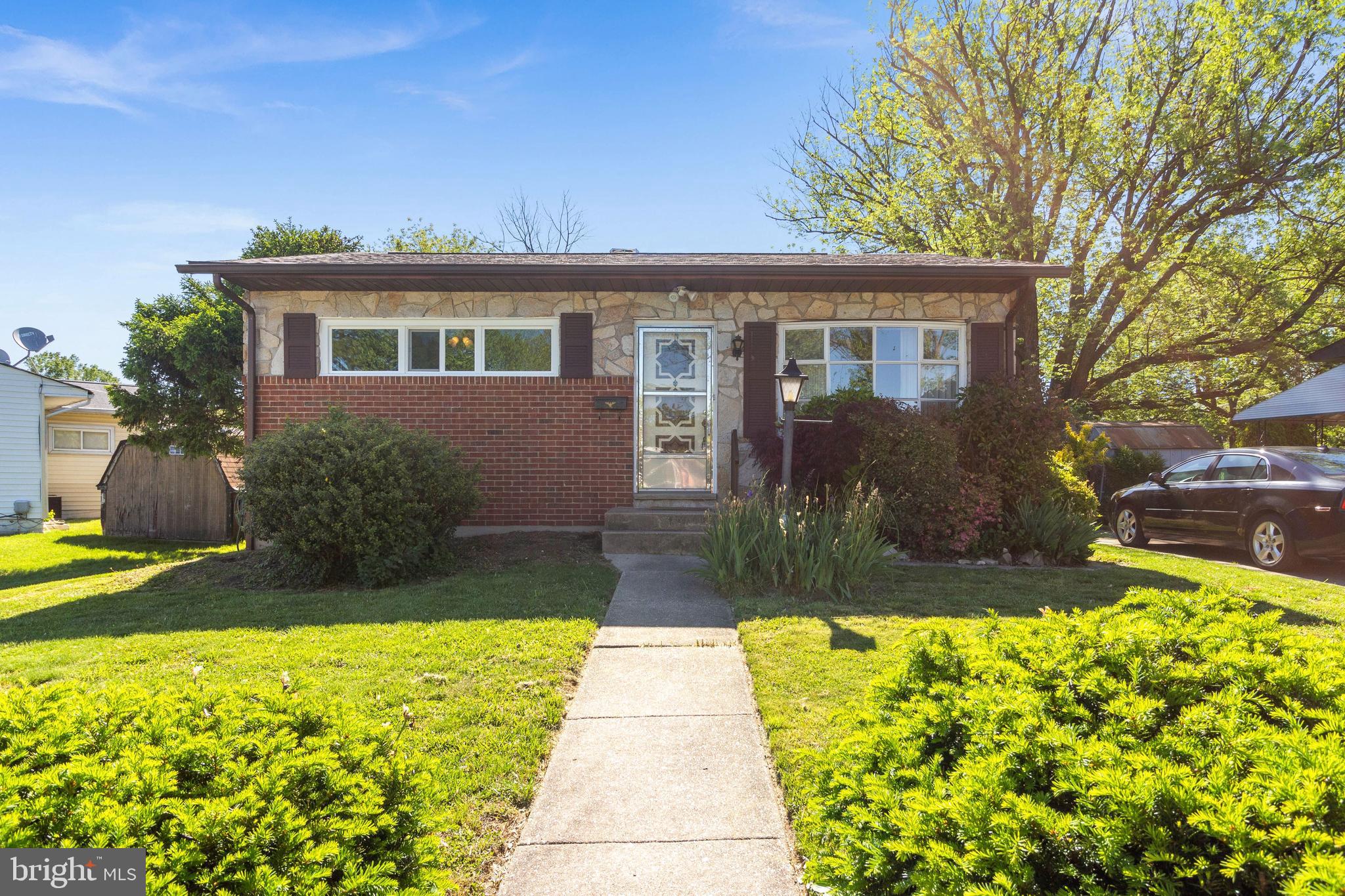 6307 Tramore Road Baltimore, MD 21214 - Photo 1 of 19 a front view of a house with garden