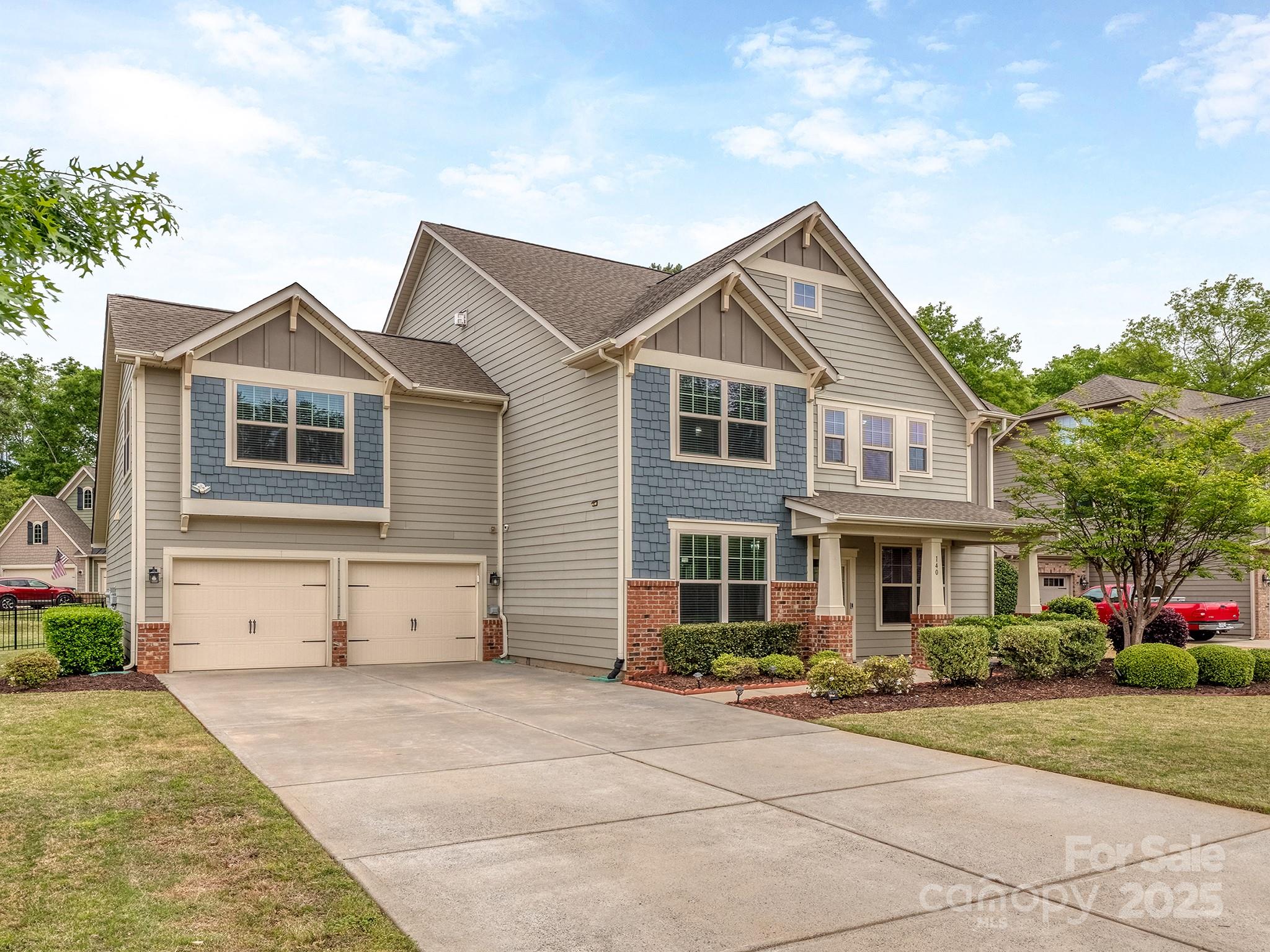 140 Halifax Drive Fort Mill, SC 29707 - Photo 1 of 38 a front view of a house with a yard and garage