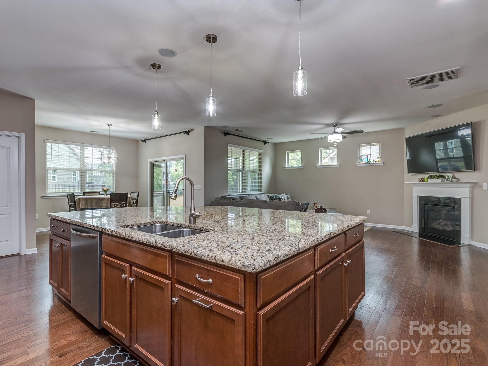 140 Halifax Drive Fort Mill, SC 29707 - Photo 12 of 38 a kitchen with kitchen island granite countertop a sink and counter space