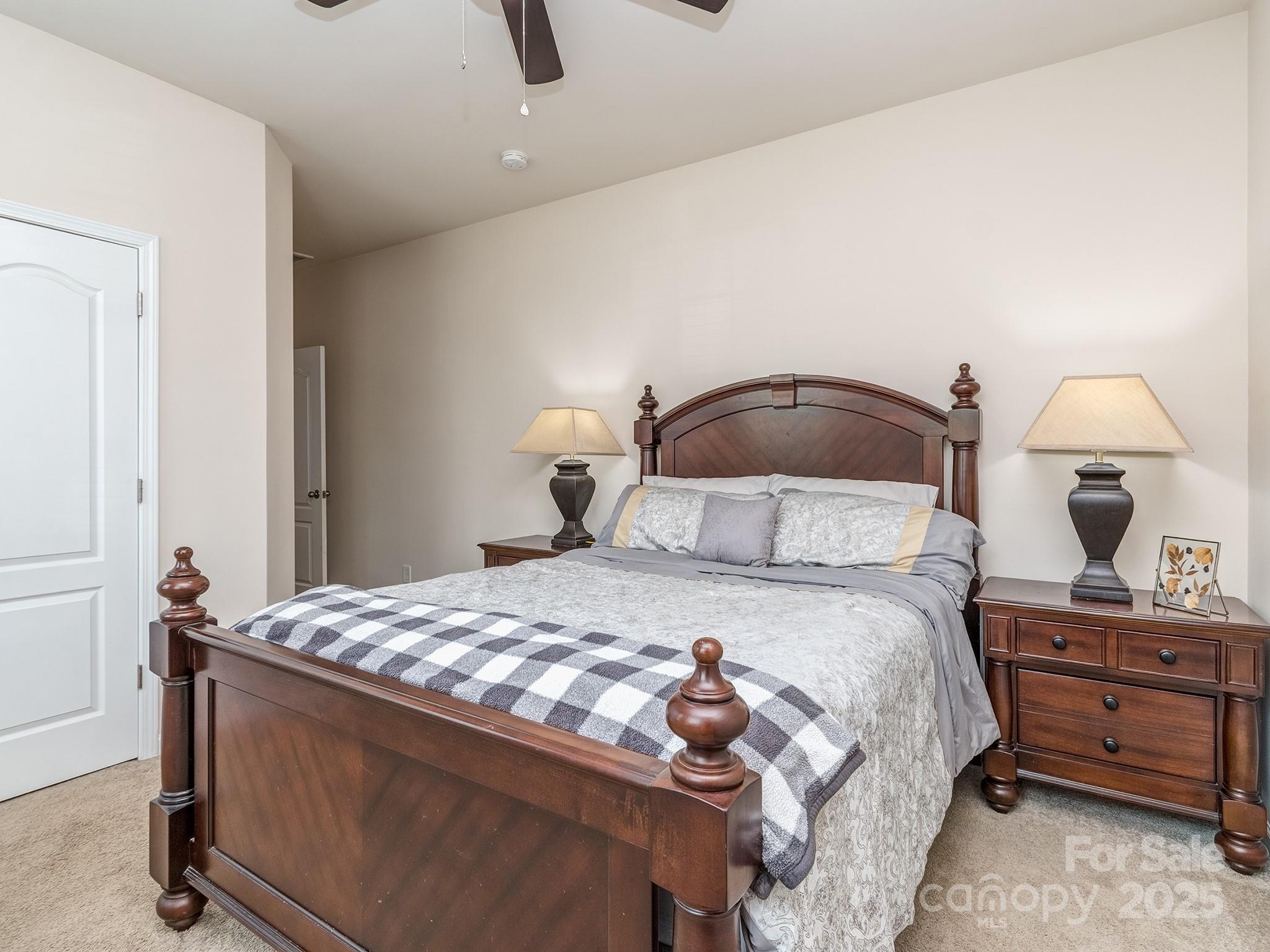 140 Halifax Drive Fort Mill, SC 29707 - Photo 15 of 38 a bedroom with a bed and a dresser