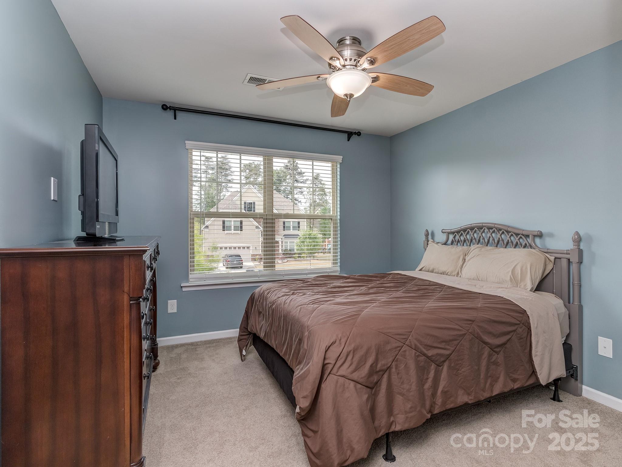 140 Halifax Drive Fort Mill, SC 29707 - Photo 22 of 38 a bedroom with a large bed and a window
