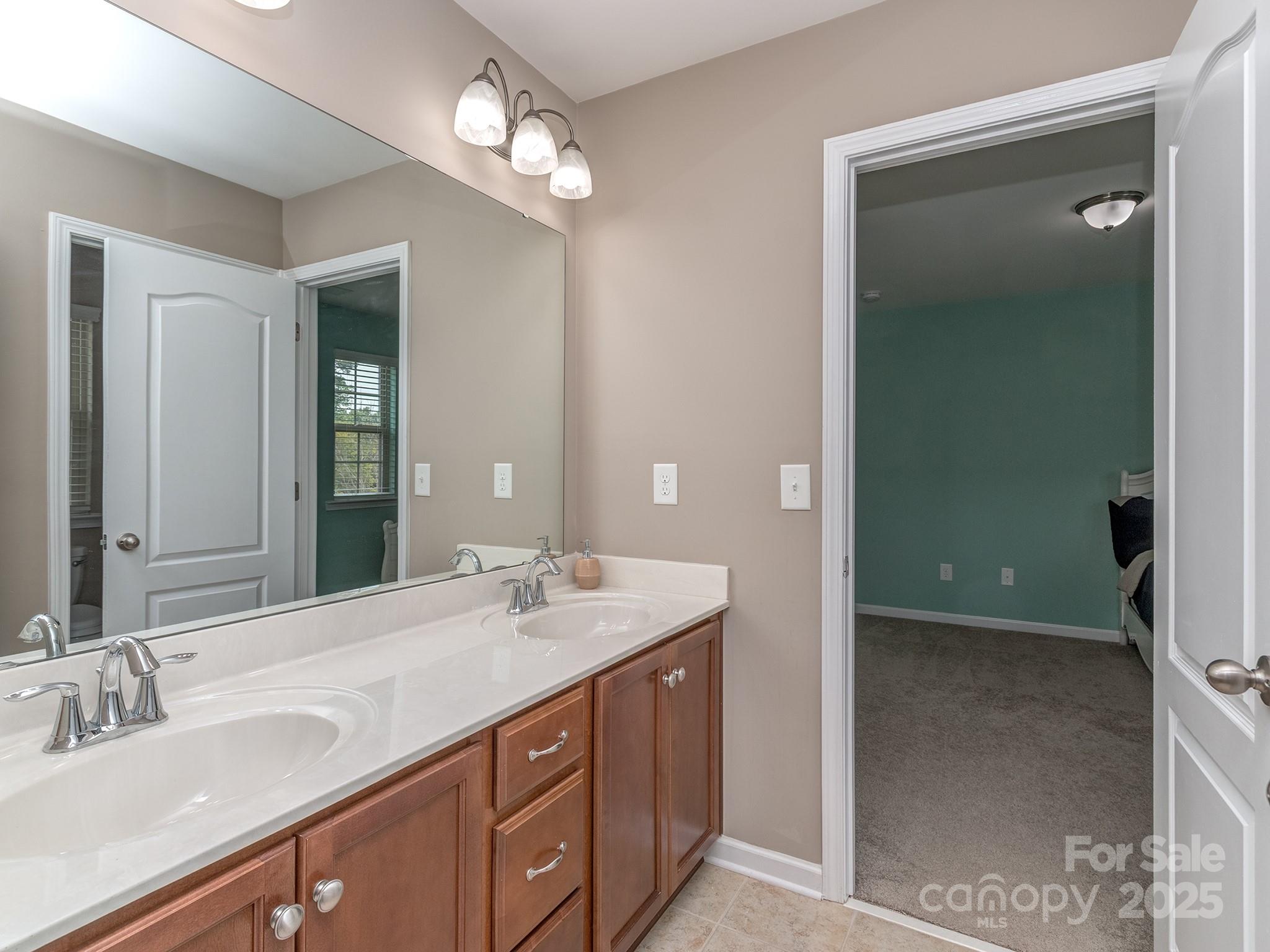 140 Halifax Drive Fort Mill, SC 29707 - Photo 23 of 38 a bathroom with a sink double vanity and a mirror