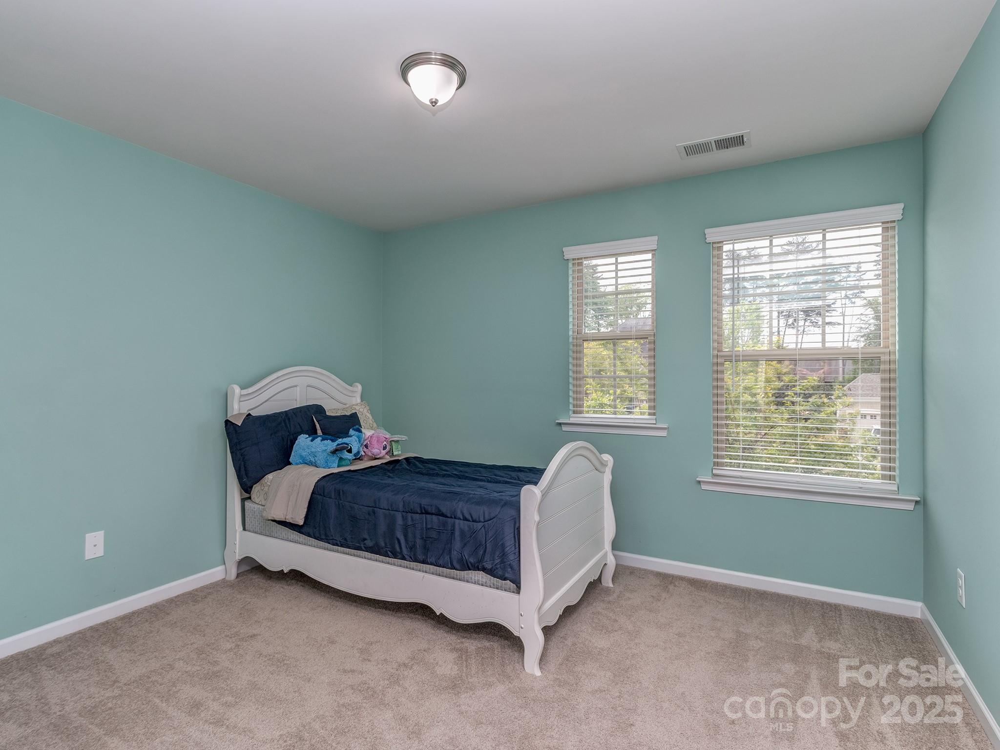 140 Halifax Drive Fort Mill, SC 29707 - Photo 24 of 38 a bed sitting in a bedroom next to a window