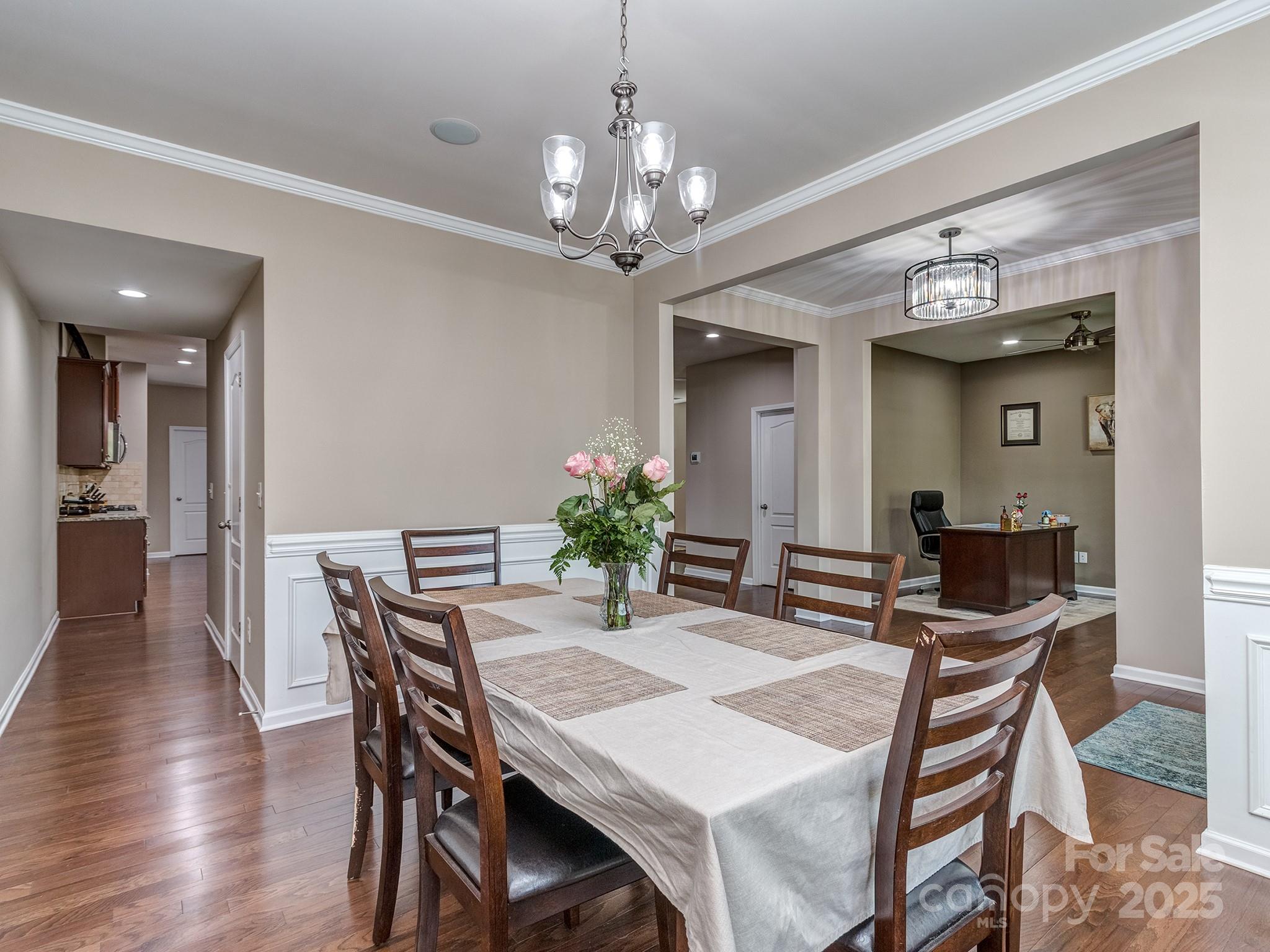 140 Halifax Drive Fort Mill, SC 29707 - Photo 5 of 38 a view of a dining room with furniture and wooden floor