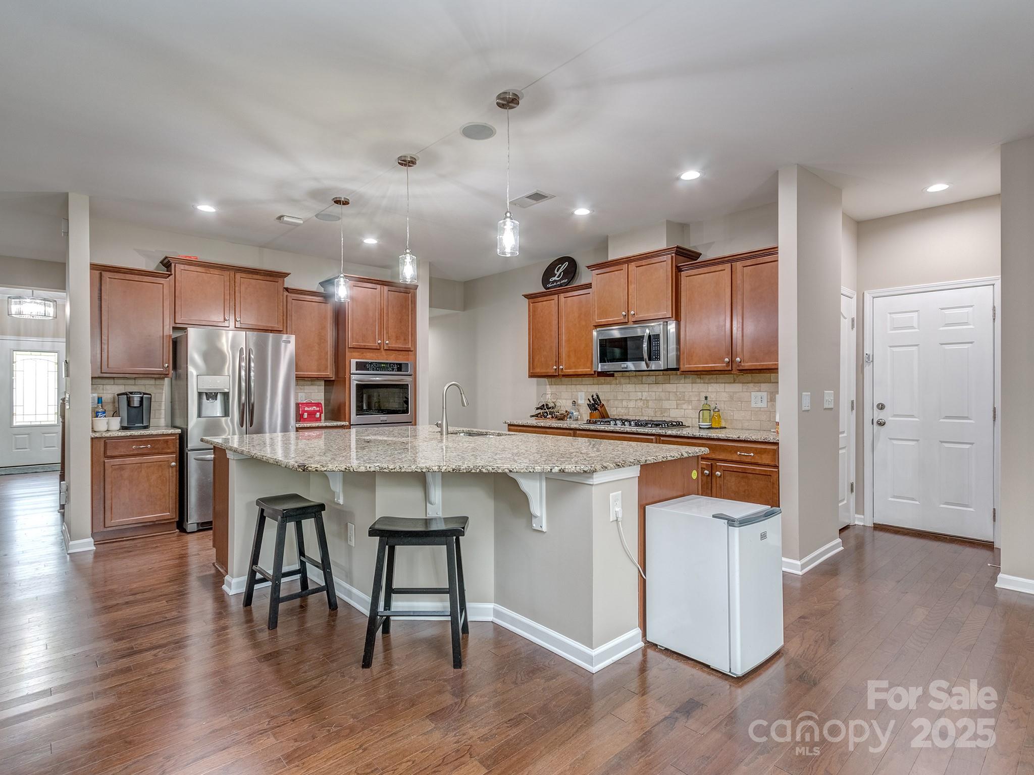 140 Halifax Drive Fort Mill, SC 29707 - Photo 10 of 38 a kitchen with stainless steel appliances granite countertop a refrigerator and a stove top oven