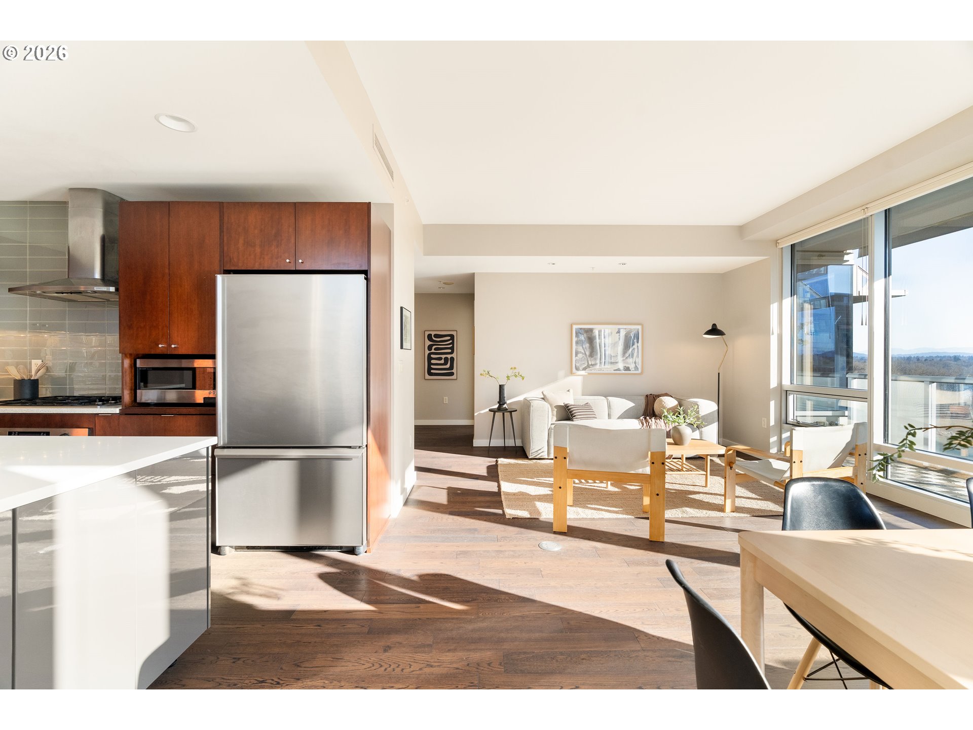 836 South Curry Street, Unit 1304 Portland, OR 97239 - Photo 11 of 34 a living room with furniture wooden floor and a large window