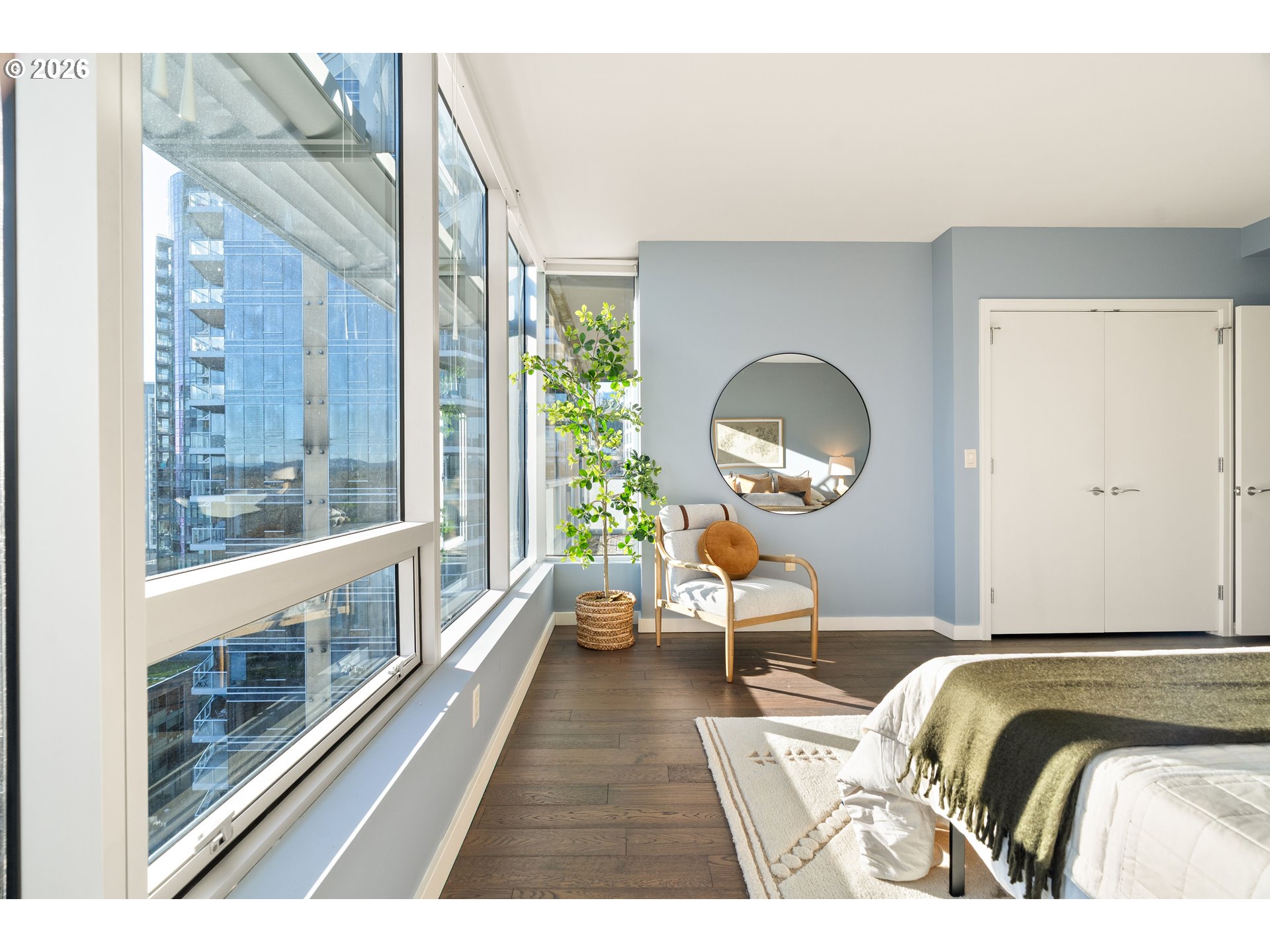 836 South Curry Street, Unit 1304 Portland, OR 97239 - Photo 20 of 34 a bedroom with a bed and a large window with outer view