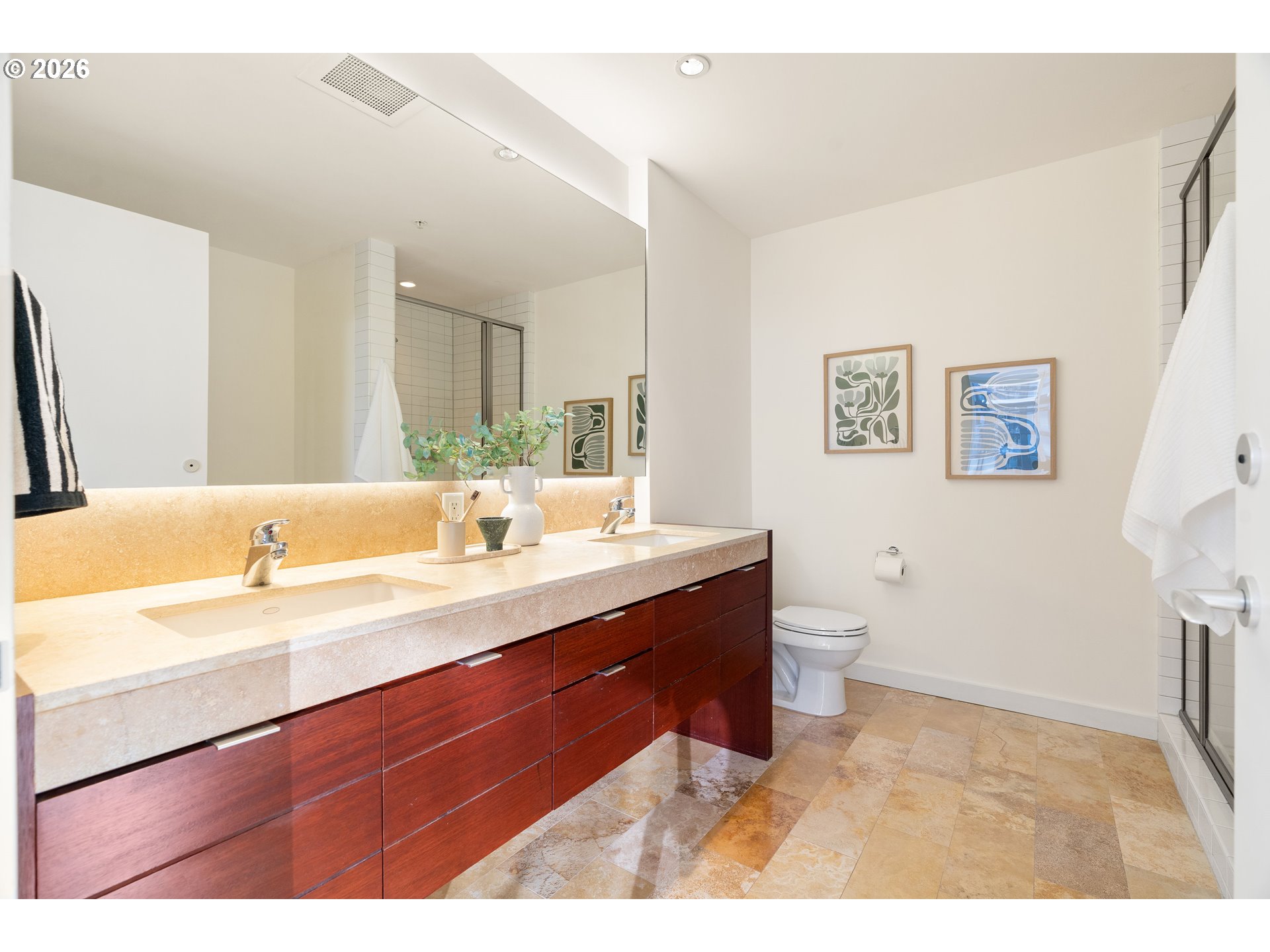 836 South Curry Street, Unit 1304 Portland, OR 97239 - Photo 22 of 34 a bathroom with a sink a toilet and a mirror