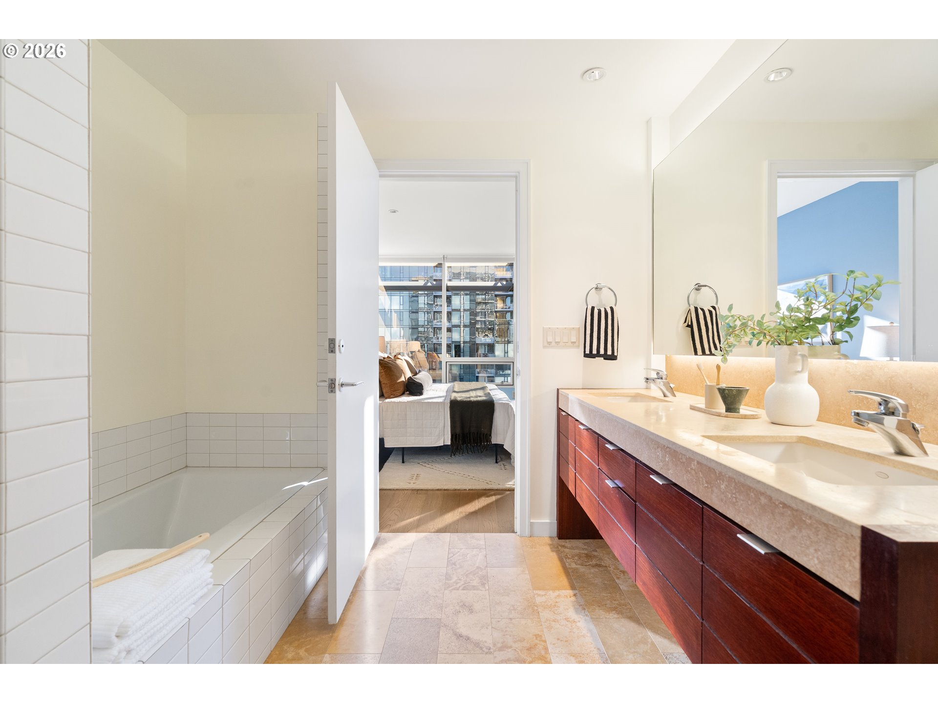 836 South Curry Street, Unit 1304 Portland, OR 97239 - Photo 23 of 34 a bathroom with a tub sink and mirror