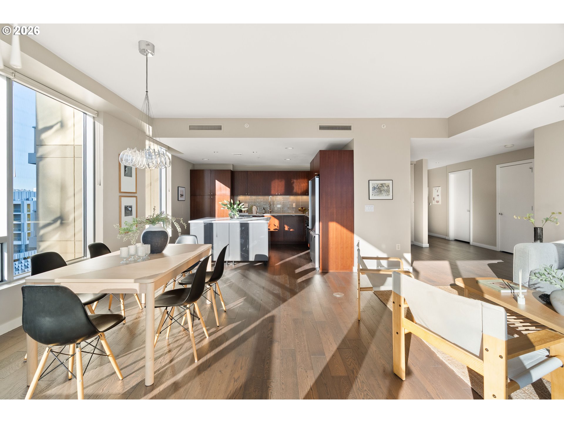 836 South Curry Street, Unit 1304 Portland, OR 97239 - Photo 8 of 34 a living room with furniture a wooden floor and a large window