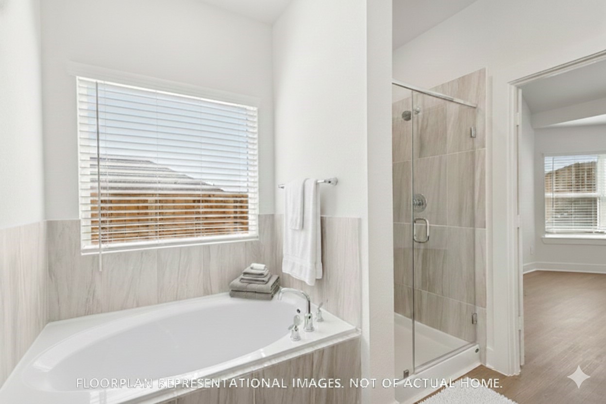 3407 Angus Farm Drive Rosenberg, TX 77471 - Photo 13 of 22 a bathroom with a bathtub and a shower