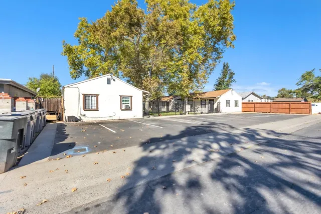 a view of road with large trees