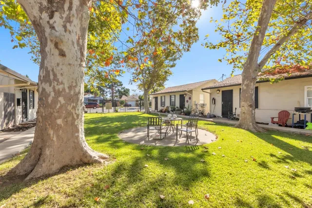 a view of a house with swimming pool and porch with furniture