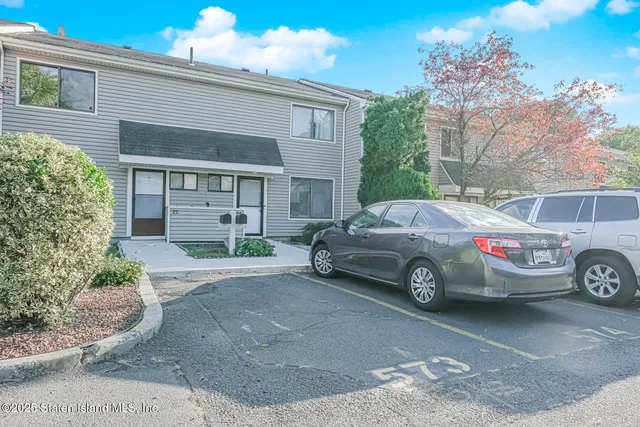 a car parked in front of a house