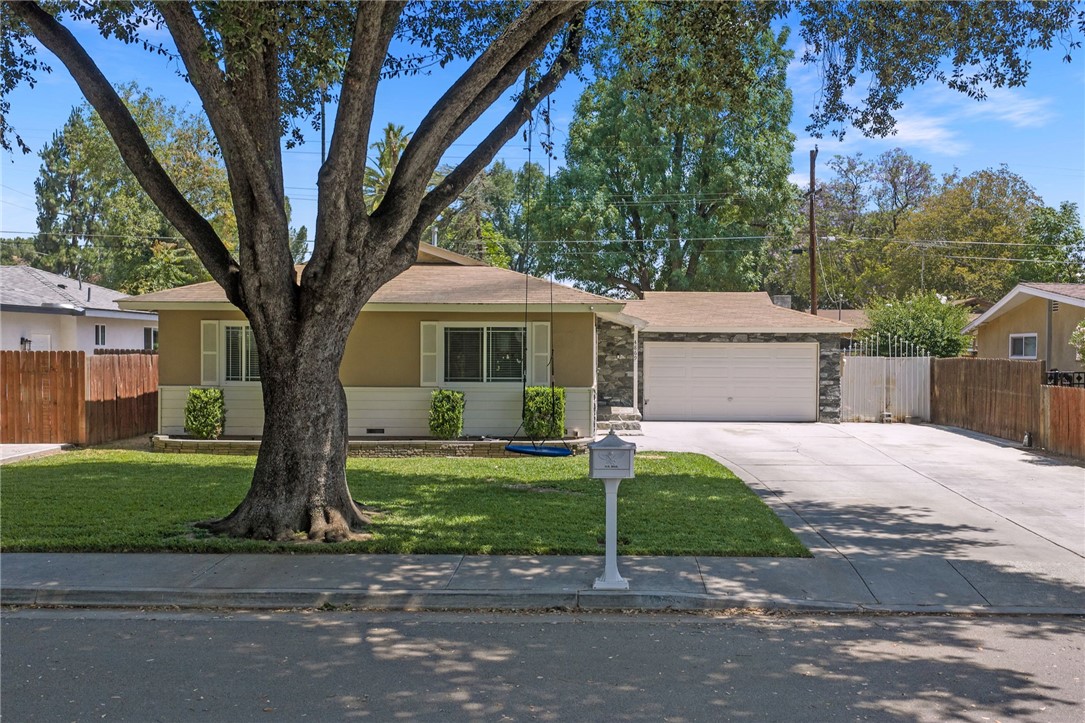 4869 Serrano Place Riverside, CA 92504 - Photo 6 of 40 Classic single-level layout with a generous driveway, attached garage, and attractive stone exterior details.