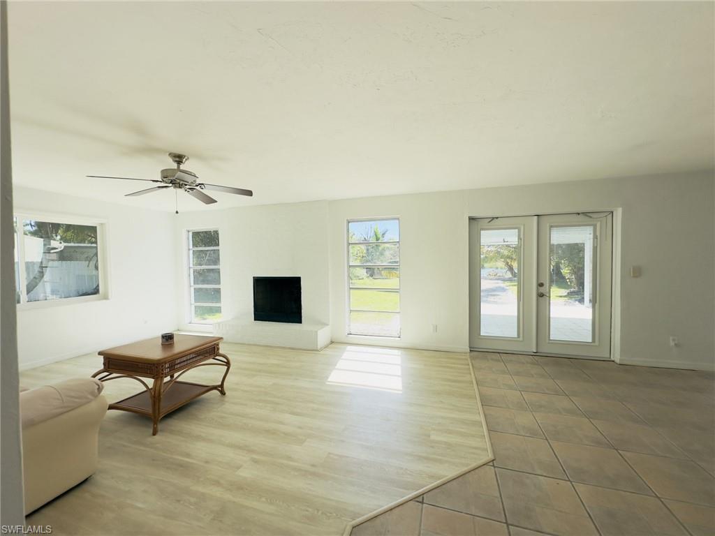 22 Constitution Drive Naples, FL 34112 - Photo 18 of 30 a living room with furniture and a flat screen tv