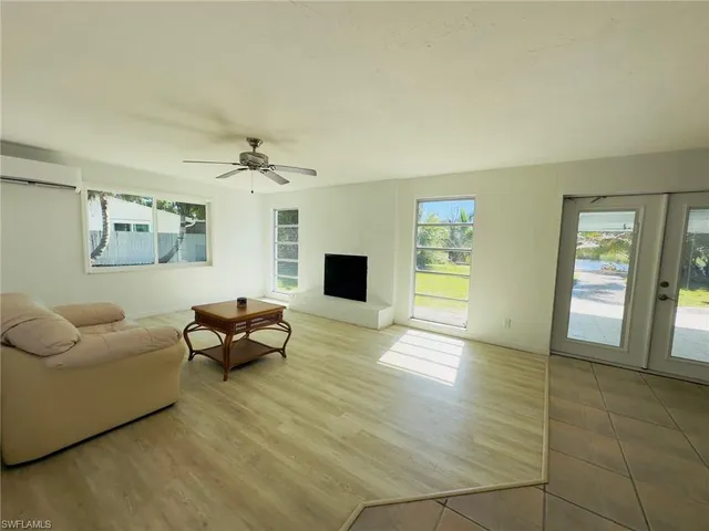 a kitchen with stainless steel appliances granite countertop a sink refrigerator and microwave