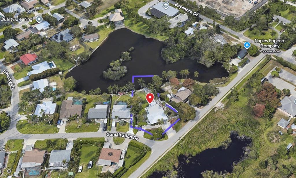 22 Constitution Drive Naples, FL 34112 - Photo 2 of 34 an aerial view of residential houses with outdoor space