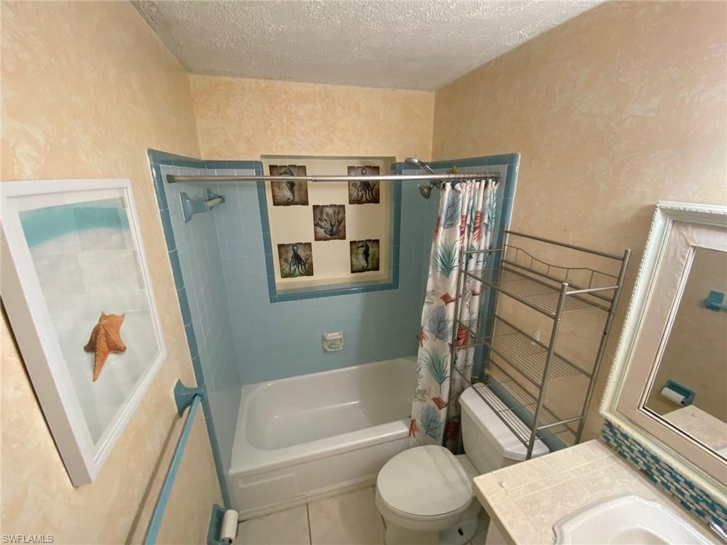 22 Constitution Drive Naples, FL 34112 - Photo 26 of 34 a bathroom with a toilet and a tub