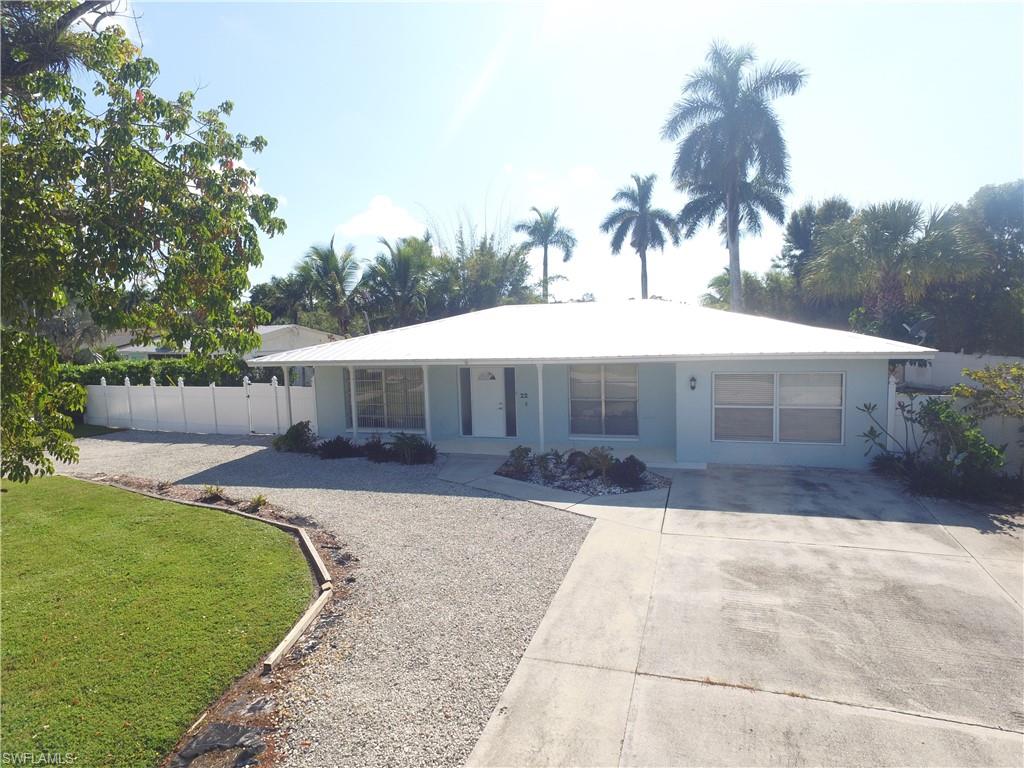 22 Constitution Drive Naples, FL 34112 - Photo 29 of 30 a front view of a house with garden