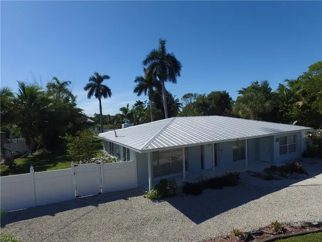 a house with trees in the background