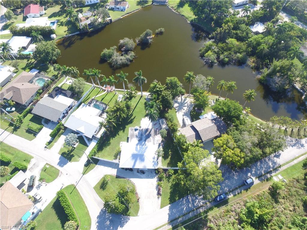 22 Constitution Drive Naples, FL 34112 - Photo 32 of 34 an aerial view of residential houses with outdoor space and boats