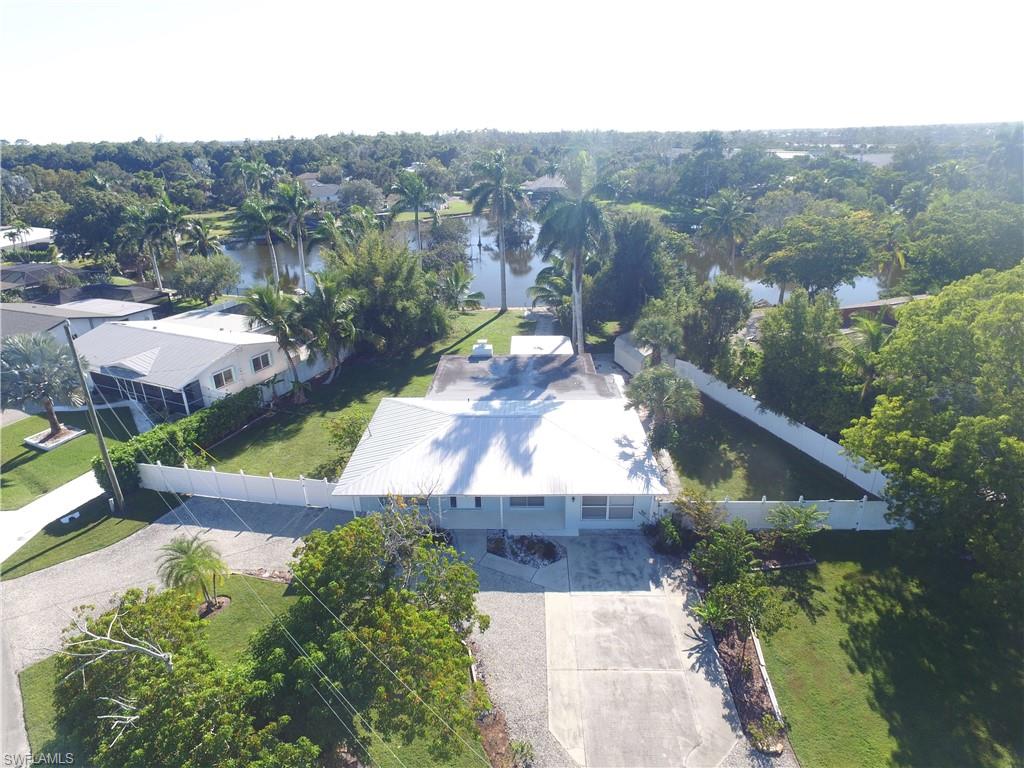 22 Constitution Drive Naples, FL 34112 - Photo 6 of 34 an aerial view of a house with a garden and mountain view