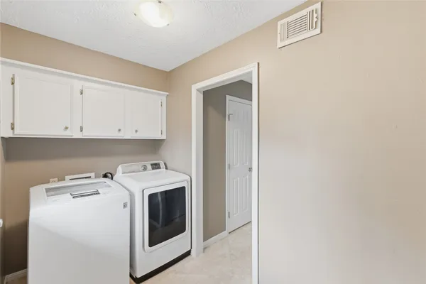 a bathroom with a sink mirror and window