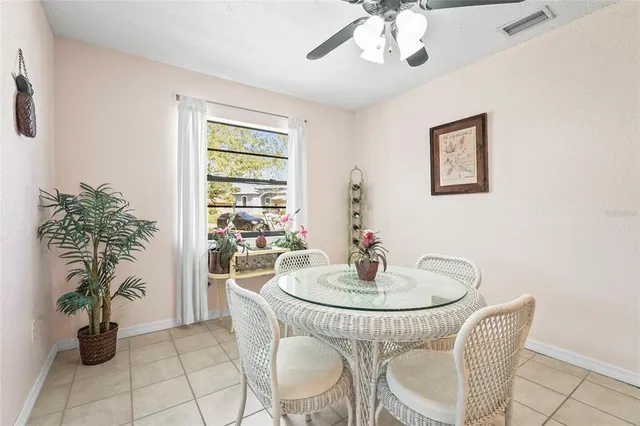 a room with lots of chairs and windows